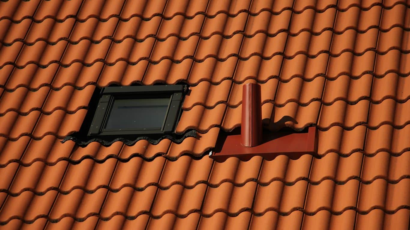 black rectangular device on brown roof