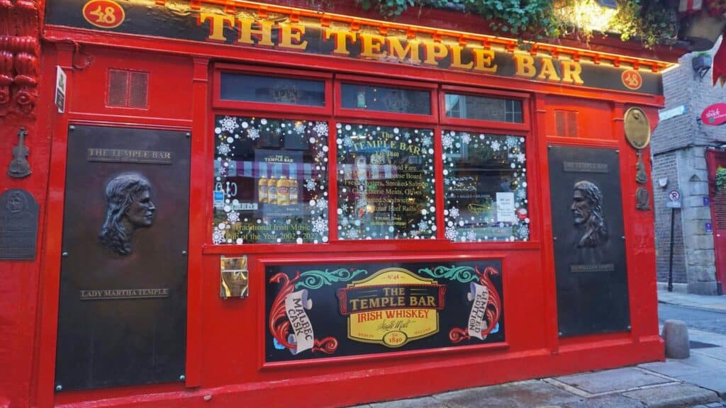 a red building with a sign that says the temple bar