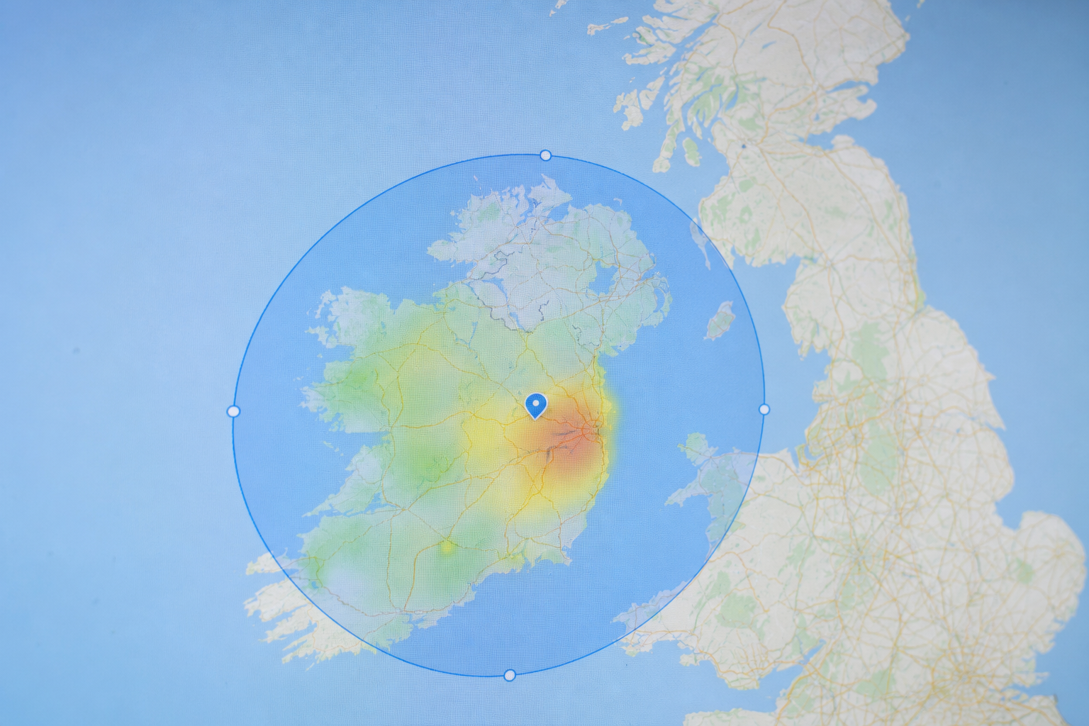 Google Ads geographic targeting map interface showing an Ireland service area with campaign spend leaking across the border into the United Kingdom