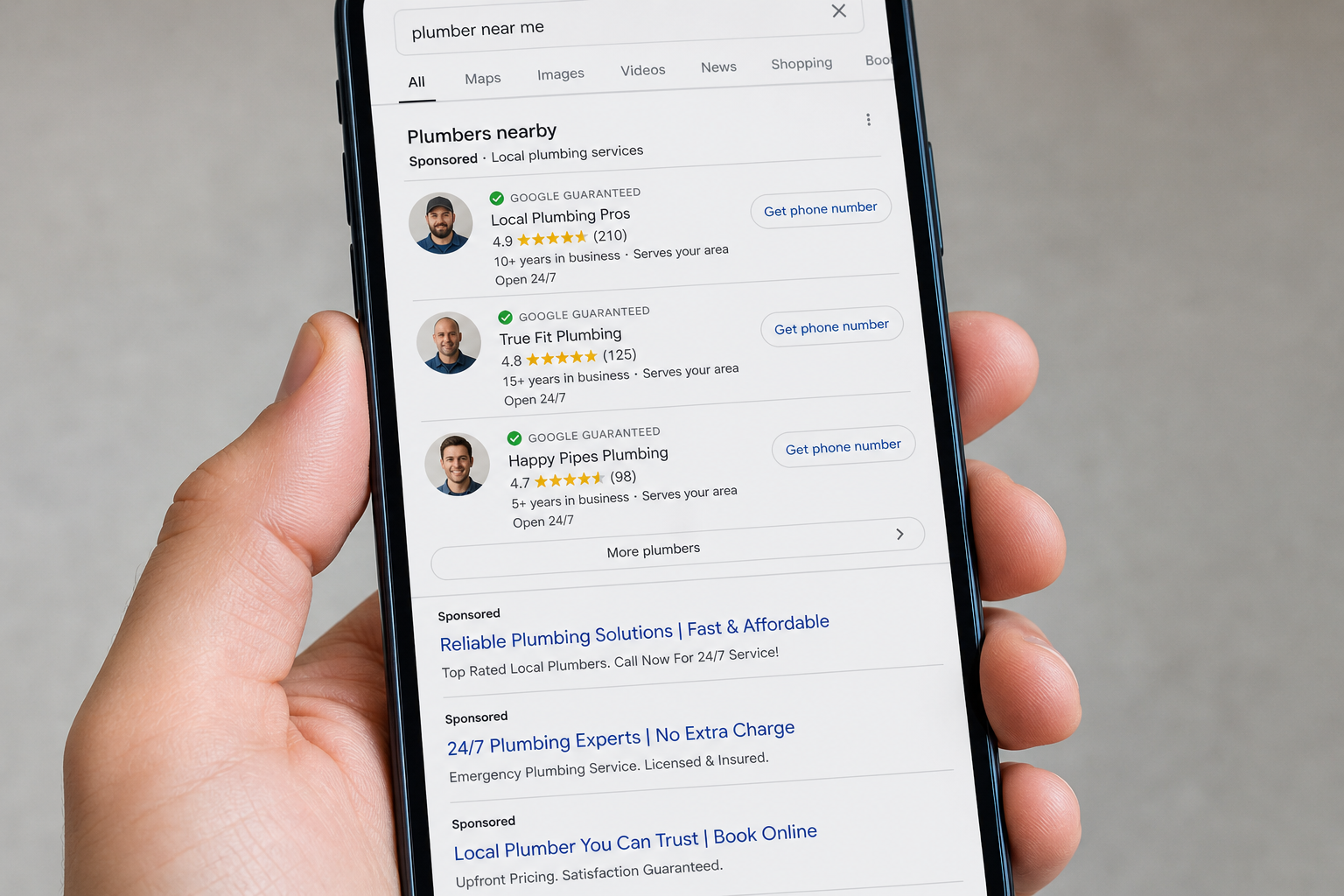A smartphone screen displaying Google search results for plumbers near me, showing a list of sponsored local plumbing businesses with ratings, reviews, and contact buttons.
